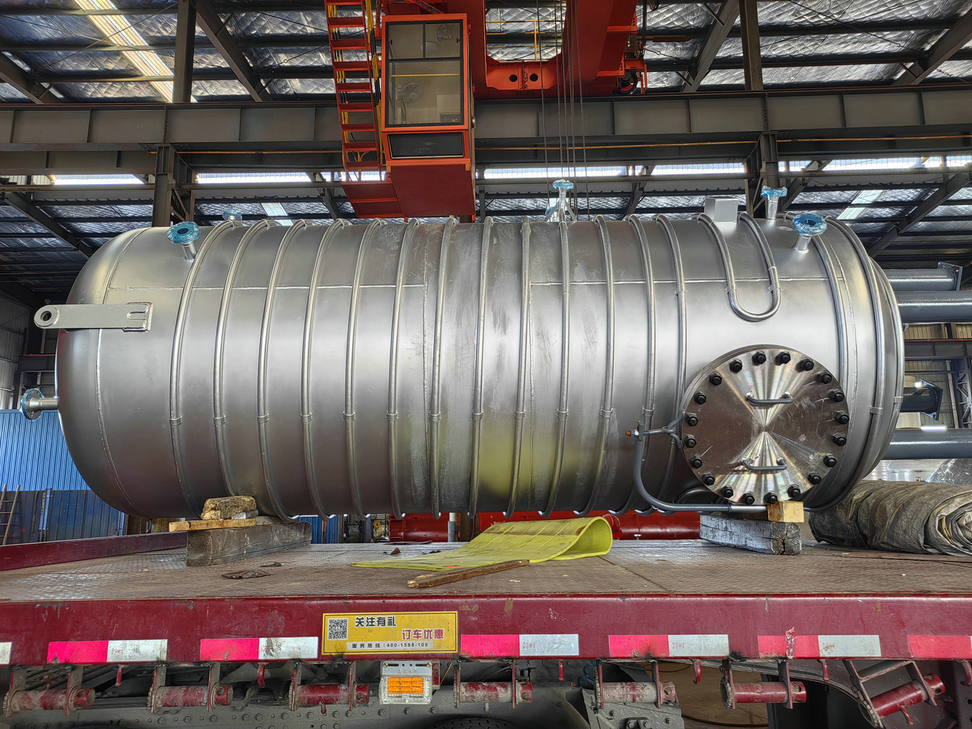 Storage tank with outer coil